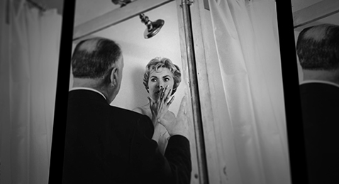 Still image of Alfred Hitchcock talking to actress Vera Miles from the film 78/52:Hitchcock's Shower Scene.